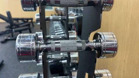 4K Close Up of 2kg Dumbbell Being Placed on Gym Rack Stock Footage 329336414