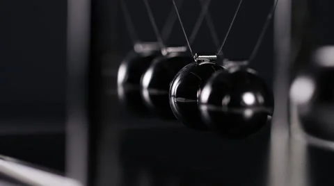 4K Close up angle of Newtons cradle spheres, in slow motion Stock-Footage 67096593