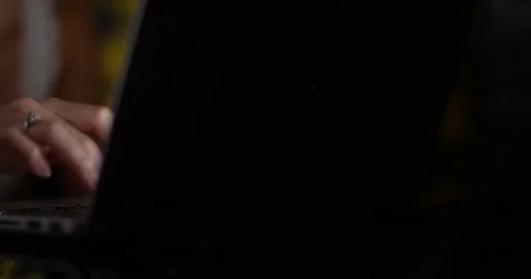 4K Close up anonymous woman working or surfing the net on laptop at night Stock Footage 83998564
