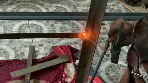 4K Close Up Arc Welding on Steel Frame with Bright Sparks and Smoke Stock Footage 340465497