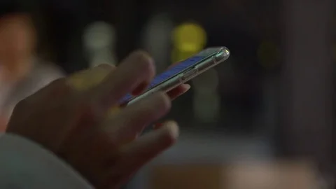 4K Close Up Of Asian Hands Using a Mobile Touch Screen Cell Phone At Night-Dan Stock Footage 70126312