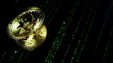 4k Close-up of Bitcoin on Code Background, Cryptocurrency Stock Footage 86048409