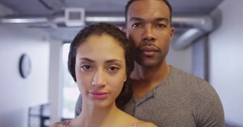 4k Close up of Black and Hispanic couple looking at camera standing in apartment 스톡 동영상 58670391