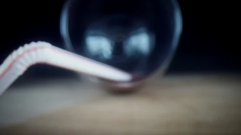 4k Close-up Bug Eye View Inside Wine Glass with Straw Stock Footage 106964915