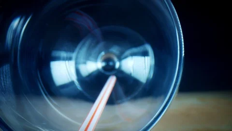 4k Close-up Bug Eye View Inside Empty Glass with Straw Stock Footage 106964971