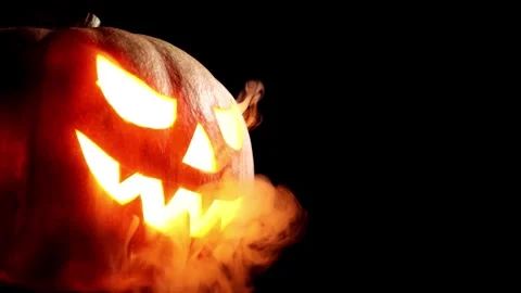 4K Close Up Carved Pumpkin Jack o Lantern Internal Light Nighttime Vídeos de archivo 339268343
