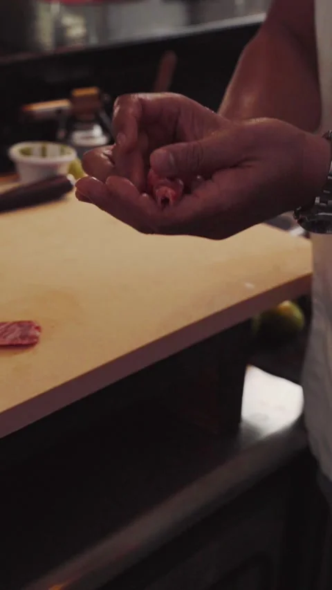 4K close up chef hands making a wagyu beef nigiri - cinematic vertical video	 Stock Footage 315123492