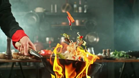 4K Close Up Chef Stir Frying Asian Noodles Vegetables Prawns in Wok Stock Footage 328536265