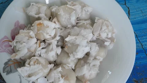 4K Close up of coconut balls or Kha Nom Tom on dish Stock Footage 154413338