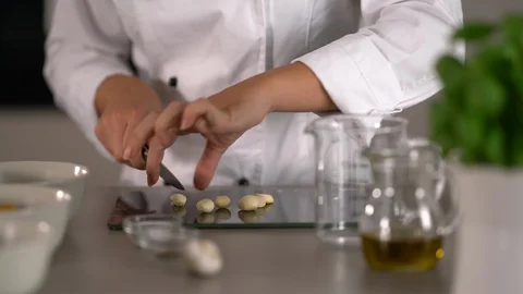 4K close up cook cutting garlic Stock Footage 105277696