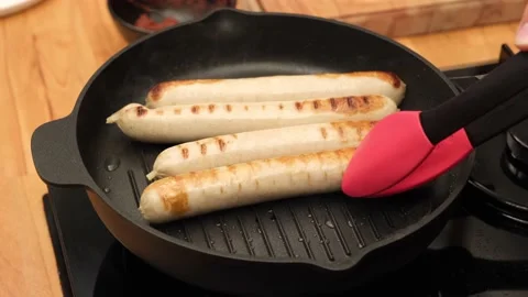 4K Close up cooking meat sausages on grill - Turkey Sausages Stock Footage 200087809
