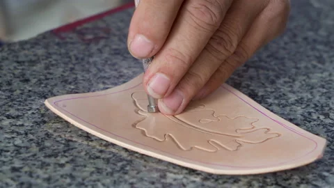 4K, Close-up cowhide cut out into shape he wanted, and hand-crafted leather.. Stock Footage 238755551