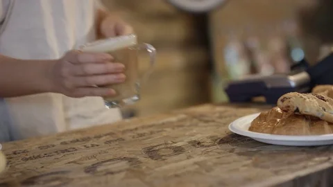 4K Close up of customer making contactless payment with smartphone in a cafe Stock Footage 76627496