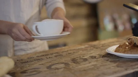 4K Close up of customer making contactless payment with smartphone in a cafe Stock Footage 76678612