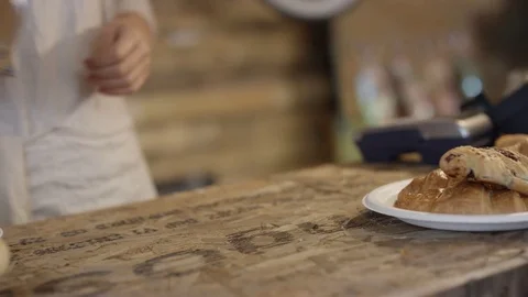 4K Close up of customer making contactless payment with smartphone in a cafe Stock Footage 76679551