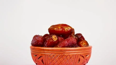 4K Close-Up Dried Sweet Dates Traditional Clay Bowl Food Footage Stock Footage 339268356