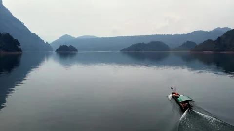4K Close-up Drone Tracking of Boat in Mist Stock Footage 332968922