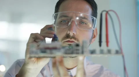 4K Close up electronics engineer working in lab building &amp; testing motherboard Stock Footage 66691220