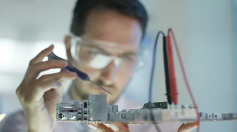 4K Close up electronics engineer working in lab building &amp; testing motherboard Stock Footage 66691496