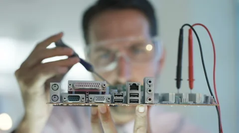 4K Close up electronics engineer working in lab building &amp; testing motherboard Stock Footage 66691497