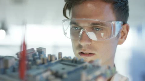4K Close up electronics engineer working in lab building &amp; testing motherboard.  Stock Footage 67436660