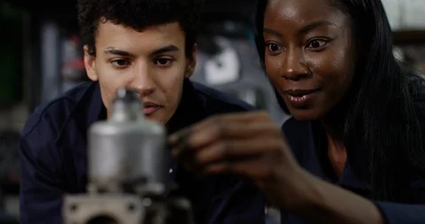 4K Close up of engineering students examining mechanical parts Stock Footage 111680682