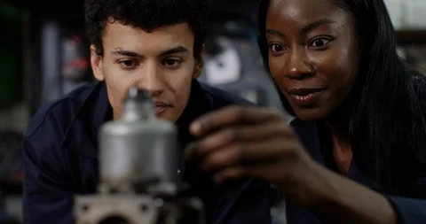 4K Close up of engineering students examining mechanical parts Stock Footage 113110861