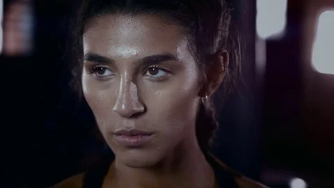 4K Close up on face of determined female athlete at the gym. Slow motion. Stock Footage 76740529