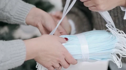 4k close-up face masks and hands Stockbeeldmateriaal 145153259