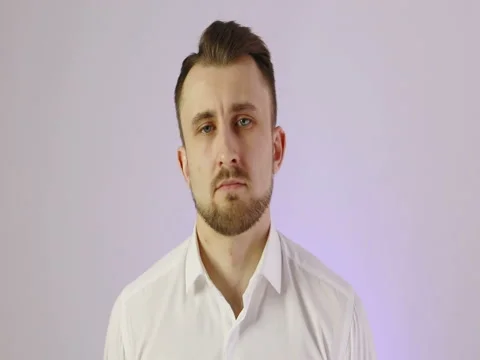 4K Close up face of a young man without emotions. Stock Footage 72974475