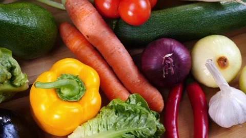 4K Close-up Fresh Raw Vegetables Tomatoes Carrots Zucchini Assortment Video stock 330479369