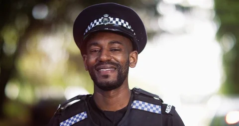 4K Close up of friendly smiling London cop outdoors on patrol Stock Footage 113260271