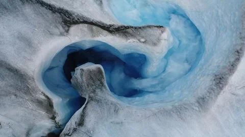 4K Close-up of Glacier Ice Cave or Crevasse Filled with Vibrant Blue Meltwater Stock Footage 324562764