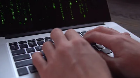 4k close-up hacker hands typing on a laptop,The Matrix style binary code on lapt Stock Footage 127184036