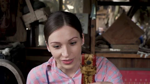 4K, close-up hand-crafted leather worker, woman sitting holding brown Stock Footage 237379451