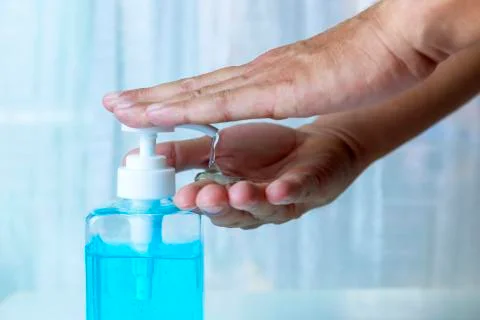 4K Close-up Hand man using hand sanitizer gel . Coronavirus hand sanitizerr g Stock Photos