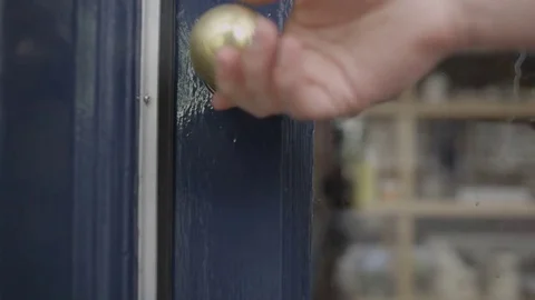 4K Close up on hand opening door to enter a shop Stock Footage 72627976
