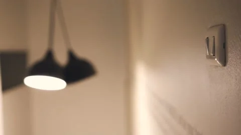 4K Close up hand switch off electric light . Concept of energy and power savi Stock Footage 134106737