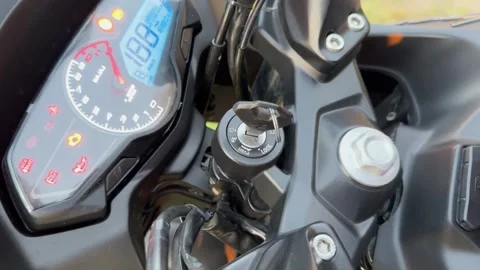 4K Close Up of Hand Turning Motorcycle Ignition Key at Sunset Stock Footage 339209284