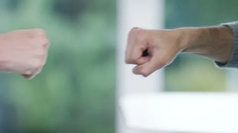 4K Close up on hands doing a fist bump. Stock Footage