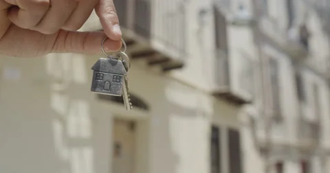 4K Close up on hands giving and receiving the key to a new home Stock Footage 68630971
