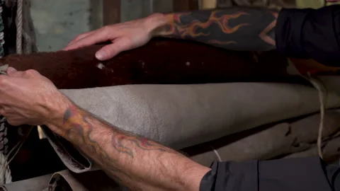 4K, Close-up hands handmade leathermakers, who is stroking touching fur on .. Stock Footage 238755459
