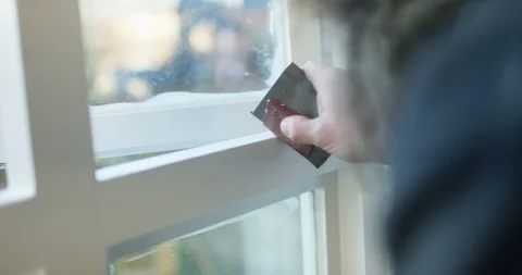 4K Close up on hands of man sanding down a window frame ready for painting Stock Footage 88214848