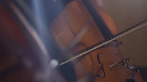 4K Close up on hands of orchestra cellist during a performance Stock Footage 68674417