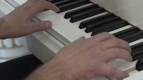 4K. Close-up of the hands of a pianist playing a musical instrument pressing. Stock Footage 164935992