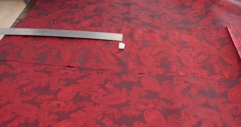 4K Close up on hands of a tailor working in his shop, drawing template on Stock Footage 130465302