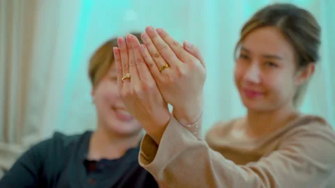 4K, Close Up The hands of two Asian women showing their wedding Stock Footage 204805509