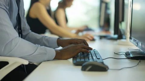 4K Close up on hands of unrecognizable worker working on computer in city office Stock Footage 64081460