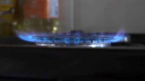 4k close up on ignition of a kitchen hob flame, cooker Stock Footage 47371760