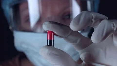 4K Close-Up Lab Scientist Holding an Antibiotic Pill Stock Footage 73060457